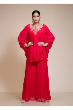 A close-up view of the Rani Pink Palazzo Set highlighting the dramatic butterfly sleeves and intricate hand-embroidery.