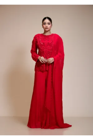 A full-length front view of the Monochrome Red Embroidered Top featuring long sleeves and wide-leg palazzo pants.