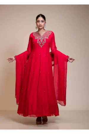 Full front view of a red organza anarkali with a heavily embroidered yoke, V-neckline, full sleeves, and matching dupatta.