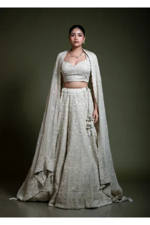 Light ivory heavily embroidered lehenga set front view with dupatta drape