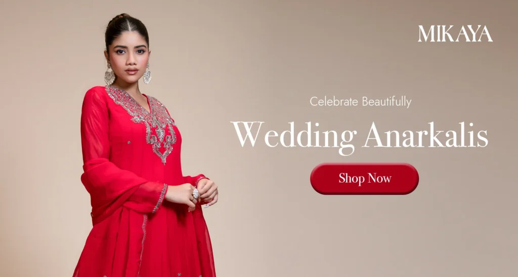 Woman wearing a red embroidered Anarkali suit with matching dupatta from Mikaya for weddings and festive celebrations.