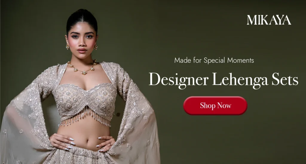 Woman wearing a designer embroidered lehenga set with cape sleeves from Mikaya for weddings, receptions and bridal celebrations.