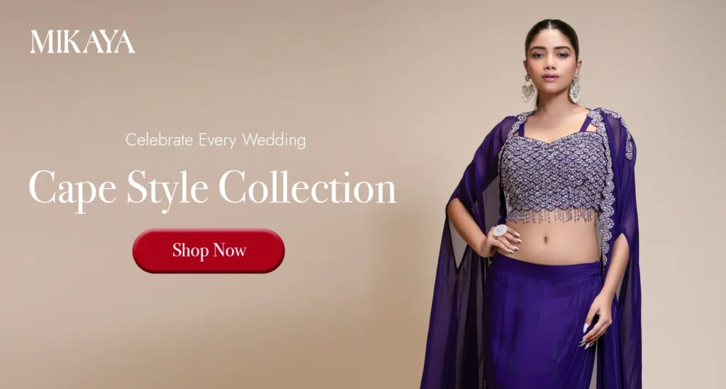 Woman wearing a purple cape style skirt set with embroidered crop top from Mikaya for wedding celebrations and festive occasions.